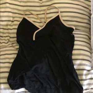 Lululemon black tank with white piping.
